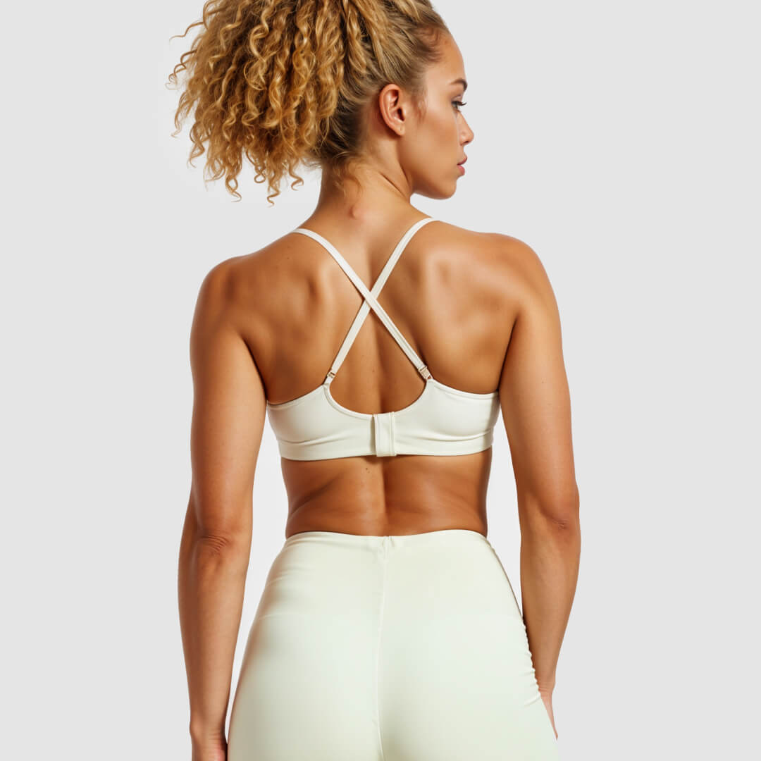 Woman wearing a beige sports bra